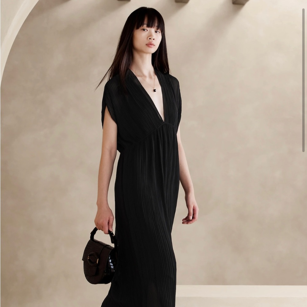 Worn once to a wedding. Pleated, flowy. SO many compliments.